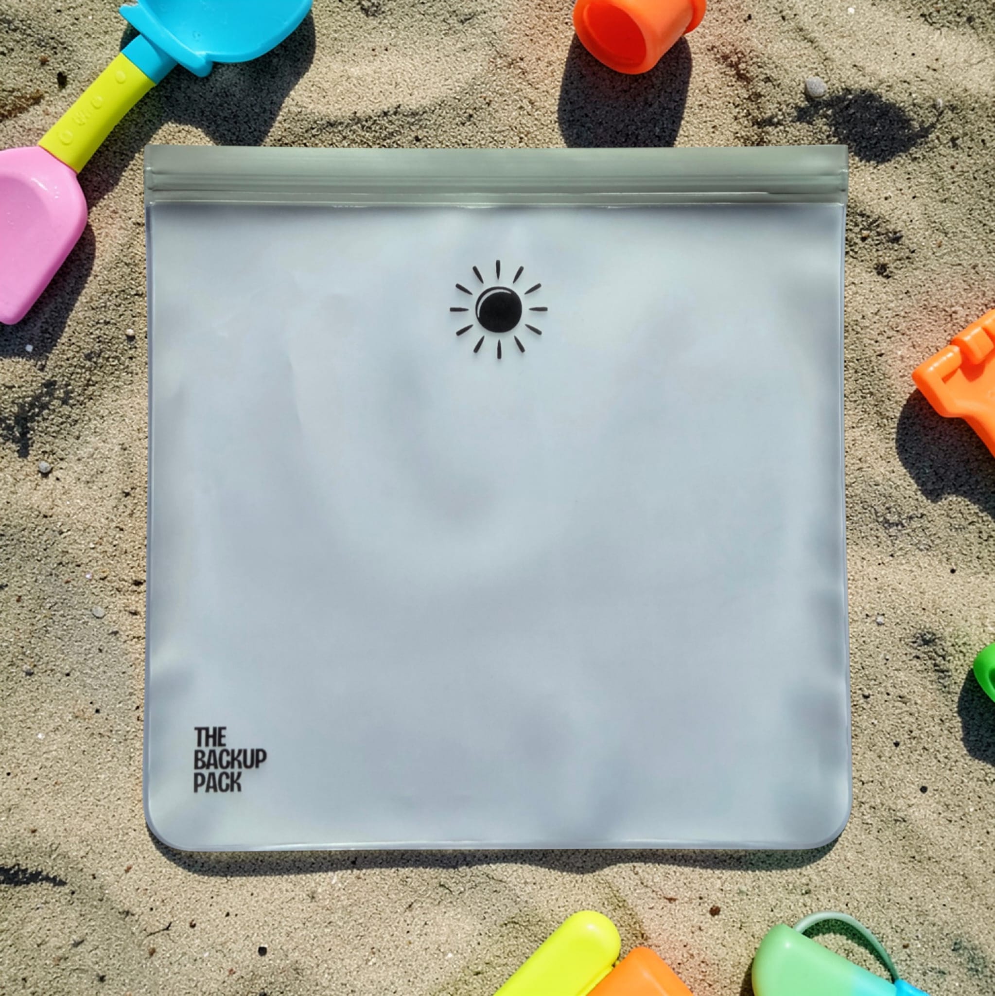 The Backup Pack PEVA reusable waterproof sleeve, sun and cloud designs holds full child's outfit - Wet/Dry Bag. Mess contained!